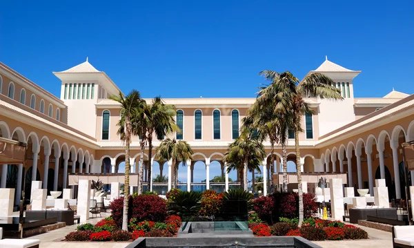 Luxury resort courtyard with palm trees